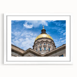 Abstract art print featuring geometric domes in muted blue and gray tones on a white framed canvas.