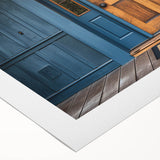 Art deco poster featuring a geometric doorway design in muted gold and navy tones on rolled canvas.