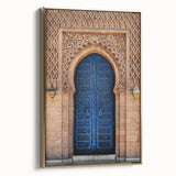 Framed canvas featuring a vintage poster of a colorful landscape with a dominant black doorway, ideal for living room decor.