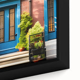 Close-up of a black framed canvas featuring a colorful, textured door design, ideal for extra large living room wall art.