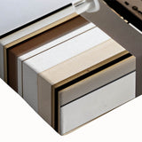 Black and white landscape painting on a large stretched canvas, featuring a detailed architectural door design.