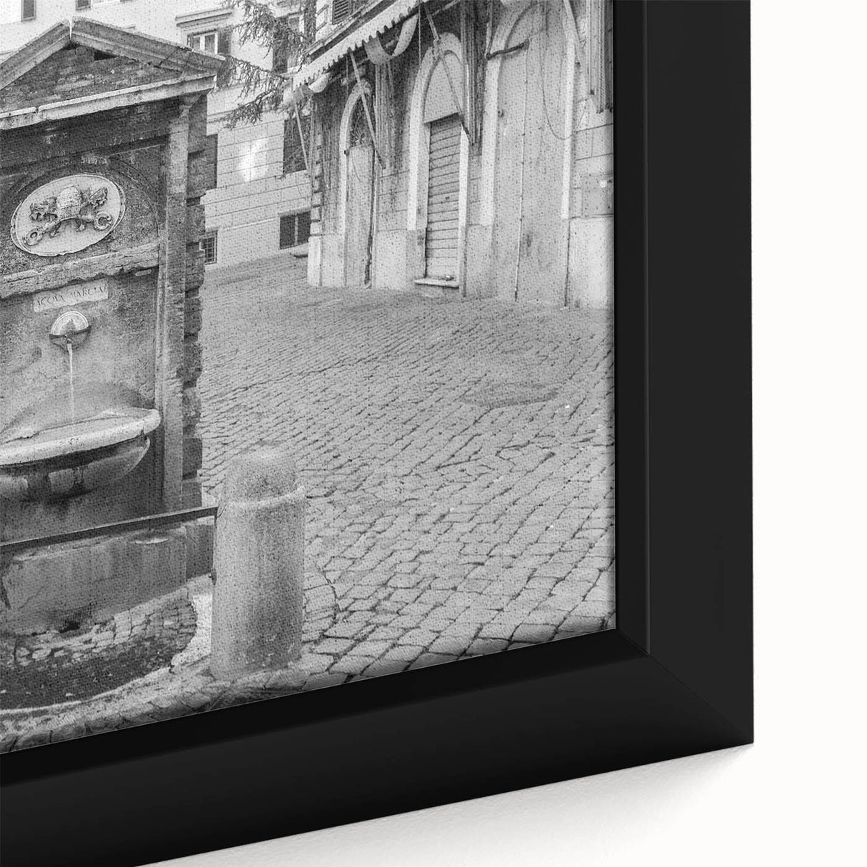 Close-up of a black framed canvas featuring a textured, colorful abstract fountain design, ideal for living room decor.