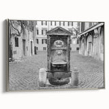 Framed canvas of a vintage-style landscape painting featuring a fountain design, in muted colors.