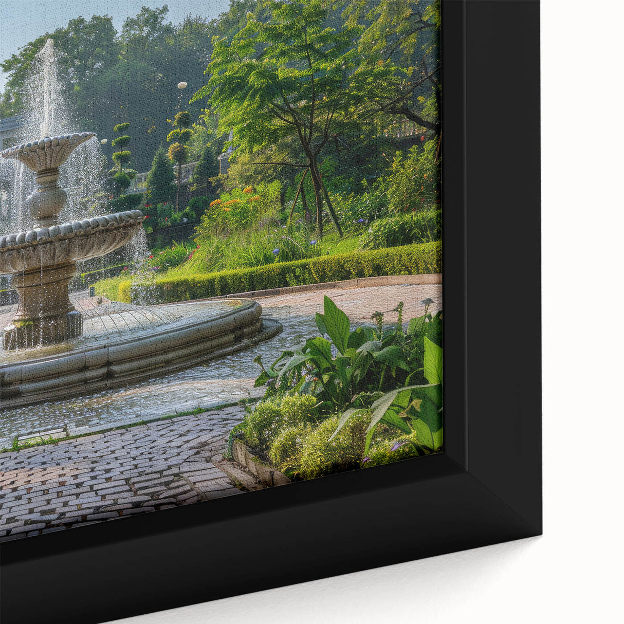 Black wall art featuring a textured fountain design with colorful accents on a framed canvas, ideal for living room decor.