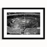 Extra large abstract art print featuring a colorful, textured fountain design on a black framed canvas.