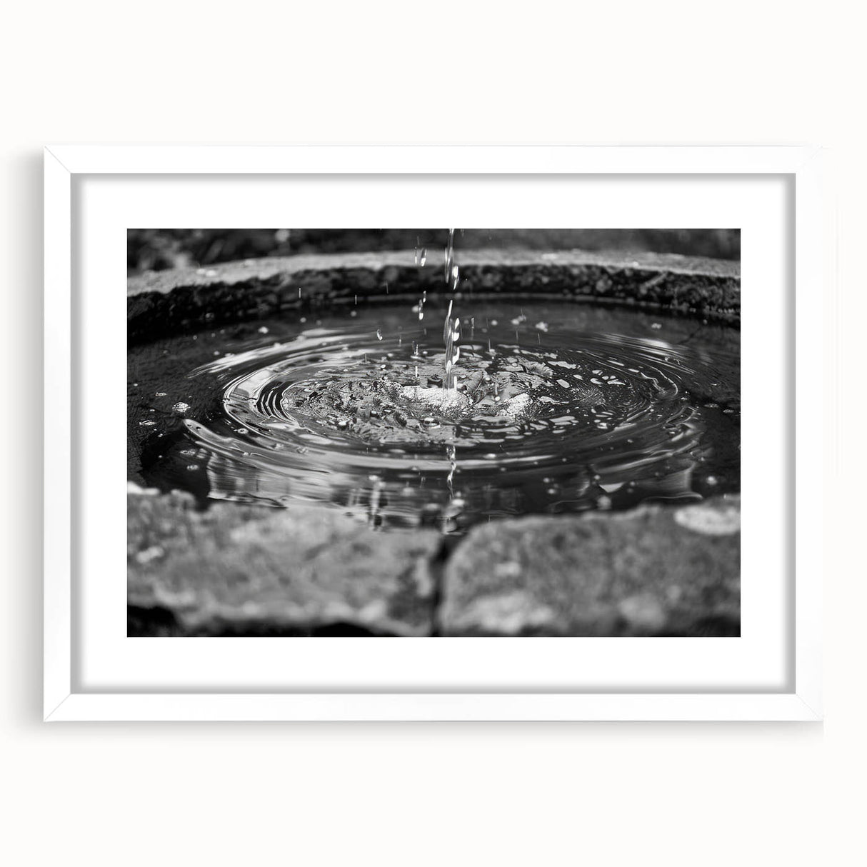 Abstract art print featuring a monochrome architectural fountain design on a white framed matte, ideal for dining room decor.