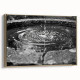 Framed canvas featuring a vintage poster art landscape with a fountain design in muted gold and black tones.