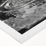 Art deco poster featuring a geometric fountain design in muted gold and navy, on rolled canvas.