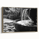Framed canvas featuring a vintage poster-style landscape painting with muted gold and black tones.