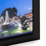 Close-up of a black wall art featuring a colorful, textured fountain design on a framed canvas.