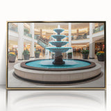 Mid-century modernist acrylic print of an architectural fountain design in gold tones, framed.