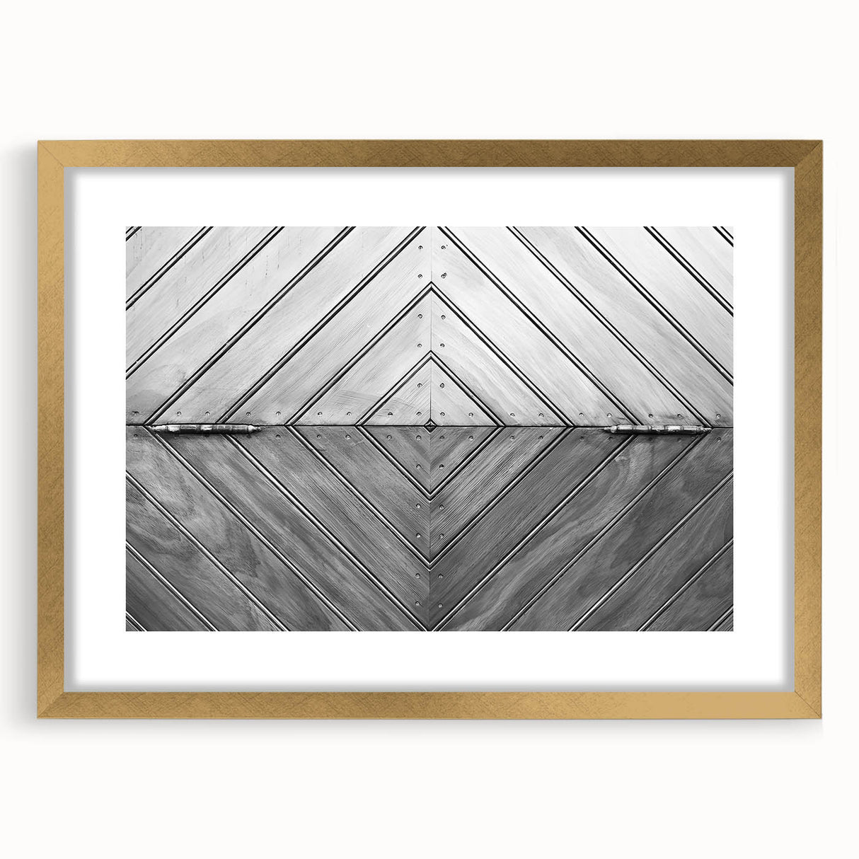 Textured abstract art print in muted gold and beige tones on a framed canvas, suitable for bedroom decor.