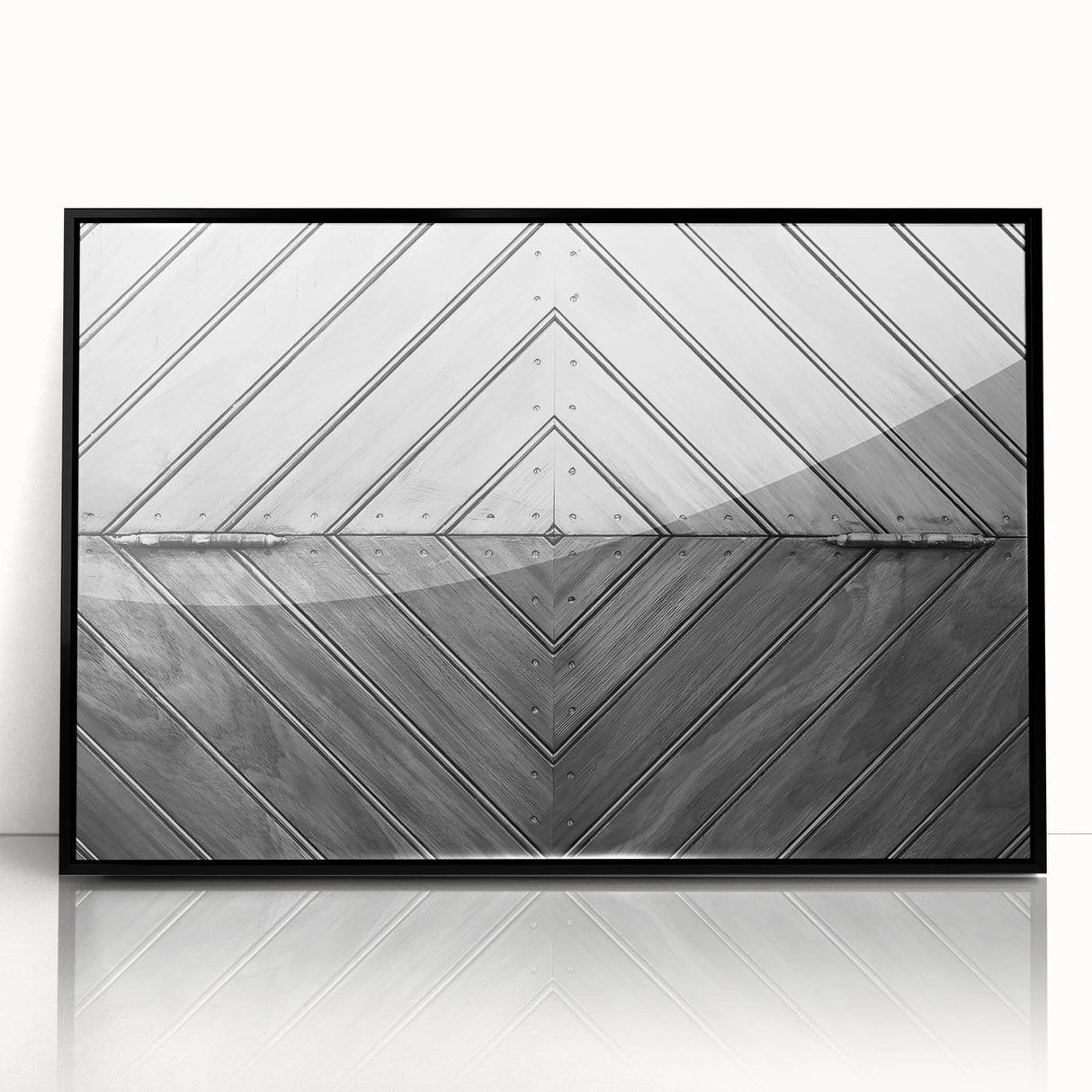 Large abstract wall art featuring geometric shapes in black and white, framed in acrylic.