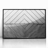 Large abstract wall art featuring geometric shapes in black and white, framed in acrylic.