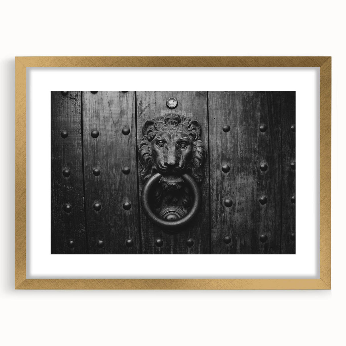 Textured abstract art print in gold frame, featuring swirling gray patterns, ideal for bedroom wall decor.