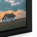 Extra large black wall art featuring a textured design of colorful, abstract houses on a framed canvas.