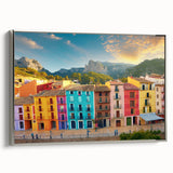 Framed canvas landscape art paintings depicting colorful vintage poster art of houses.