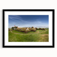 Extra large abstract art print featuring textured, colorful art of whimsical houses, framed in black.