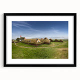 Extra large abstract art print featuring textured, colorful art of whimsical houses, framed in black.