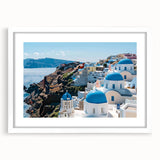 Abstract art print featuring geometric shapes in muted gray and blue tones on a white framed canvas.