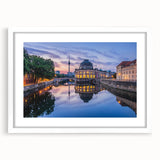 Abstract art print featuring geometric shapes in muted gray and blue tones on a framed white canvas.