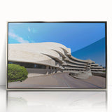 Mid-century modernist art depicting architecture and museums in muted gray tones, framed in silver acrylic.