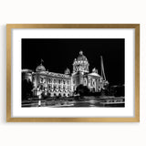 Textured abstract art print of a palace design in muted gold and beige tones, framed with a golden mat.