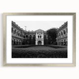 Abstract art print of a palace design in muted gray and blue tones, framed in silver, ideal for dining room decor.