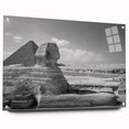 Large abstract wall art of geometric pyramids in muted earth tones on acrylic glass.