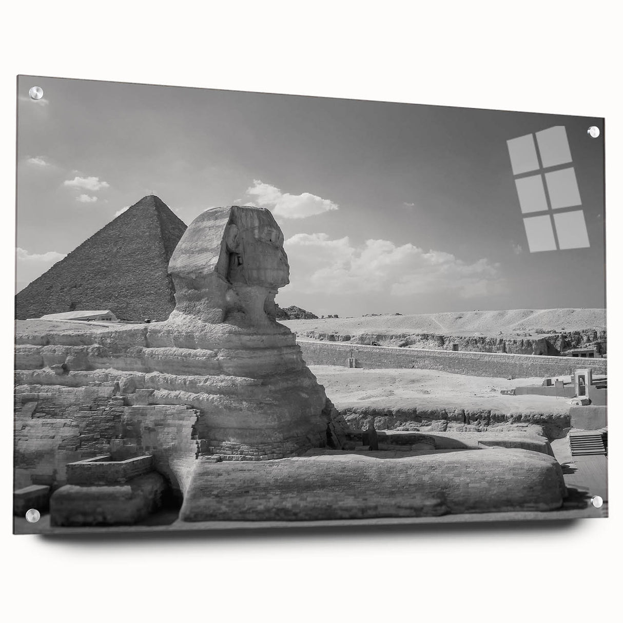 Large abstract wall art of geometric pyramids in muted earth tones on acrylic glass.
