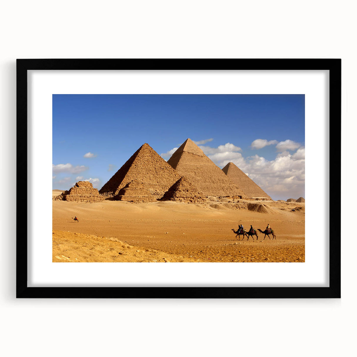 Extra large abstract art print featuring colorful textured pyramids, framed in black, ideal for living room decor.
