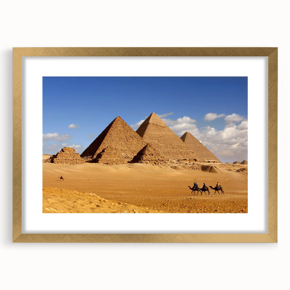 Textured art of abstract pyramids in gold and beige tones, framed with a gold mat, ideal for bedroom wall decor.