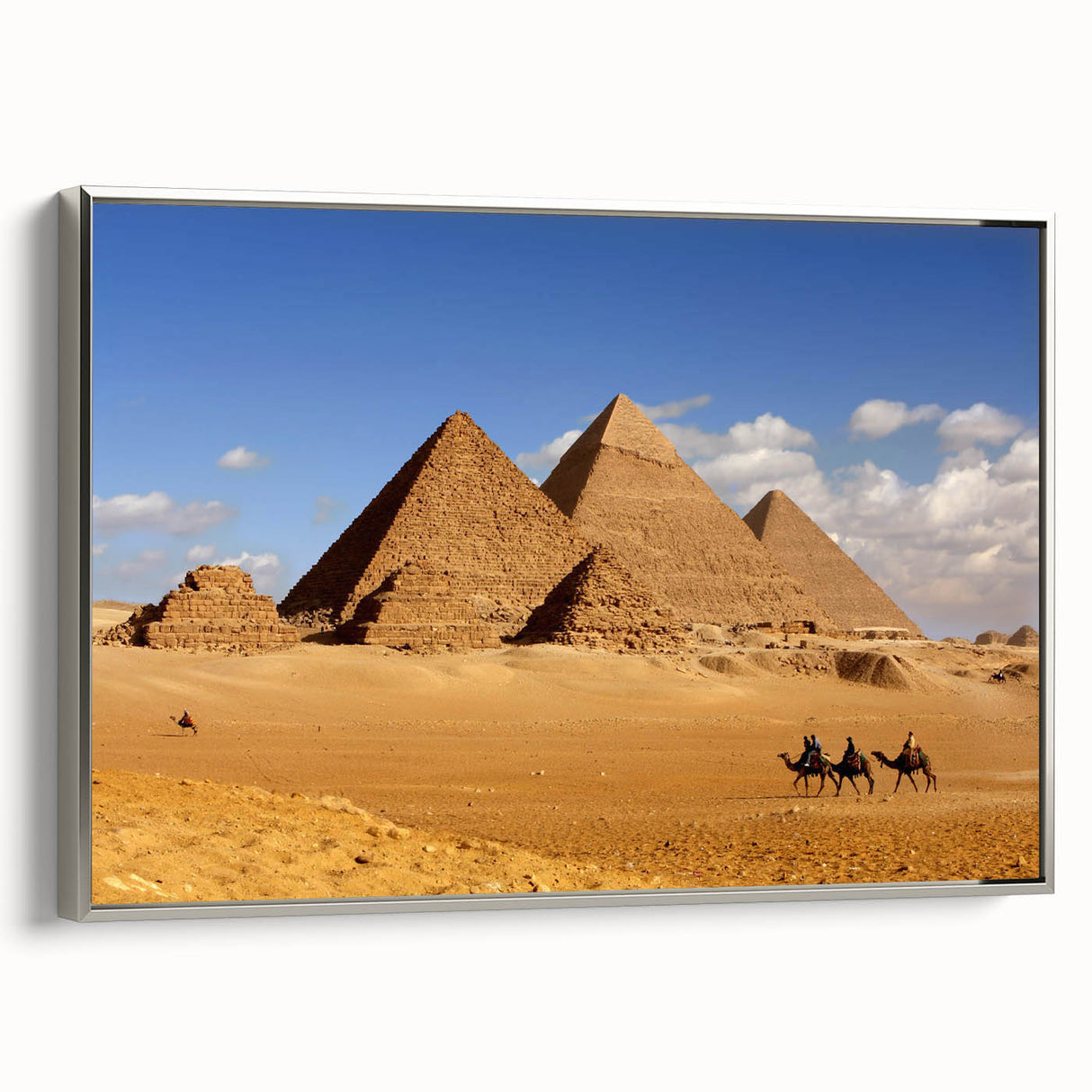 Vintage poster art of pyramids in muted black and colorful accents on a large framed canvas, suited for living room decor.