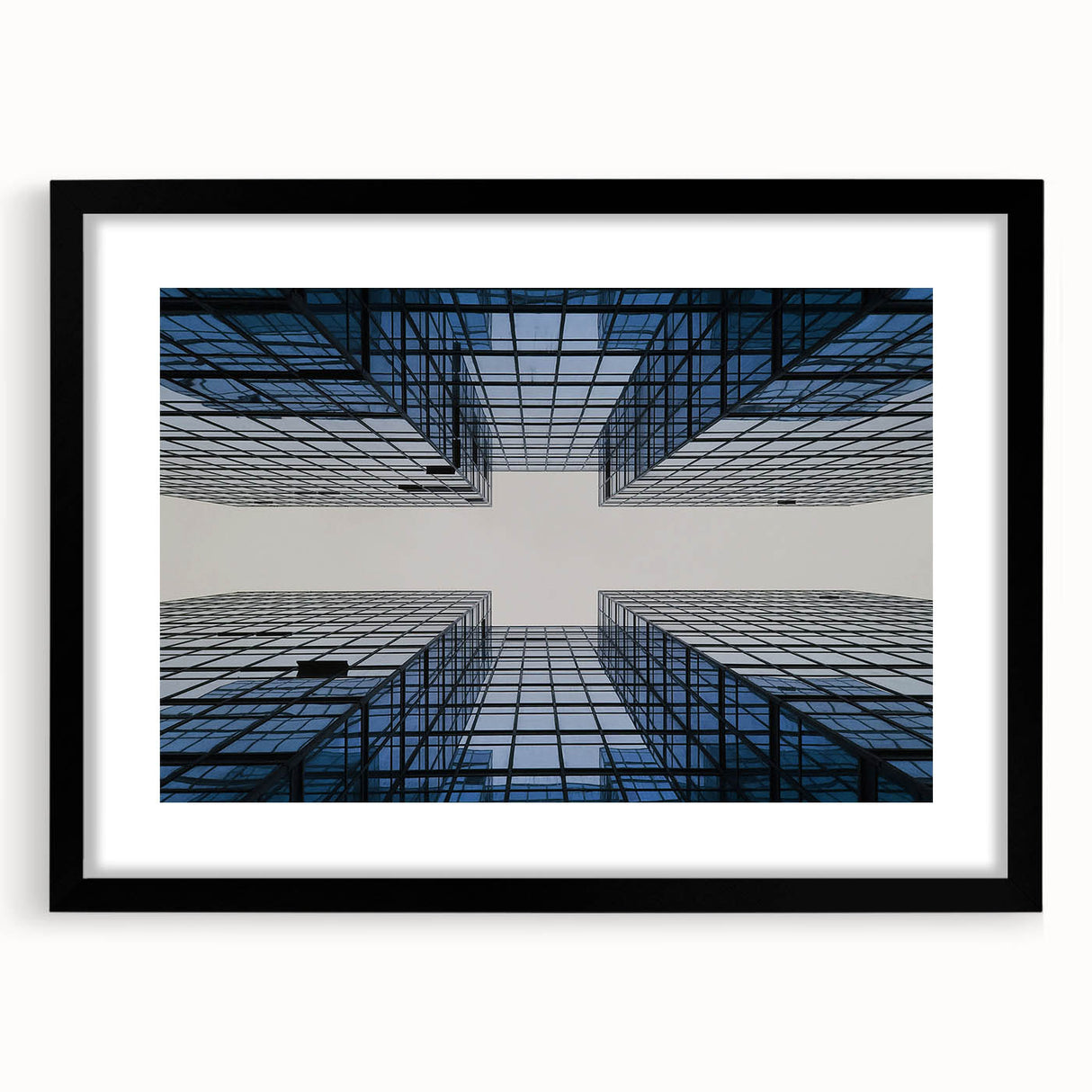 Extra large abstract art print featuring colorful, textured skyscrapers on a black framed canvas.