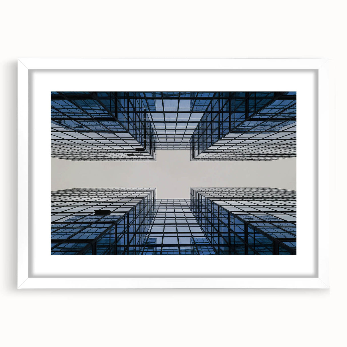 Extra large abstract art print featuring textured skyscraper design in gray tones, framed with white mat.