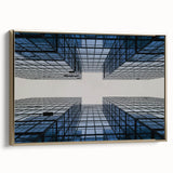 Framed canvas featuring a vintage poster of a skyscraper design in black with colorful art accents.