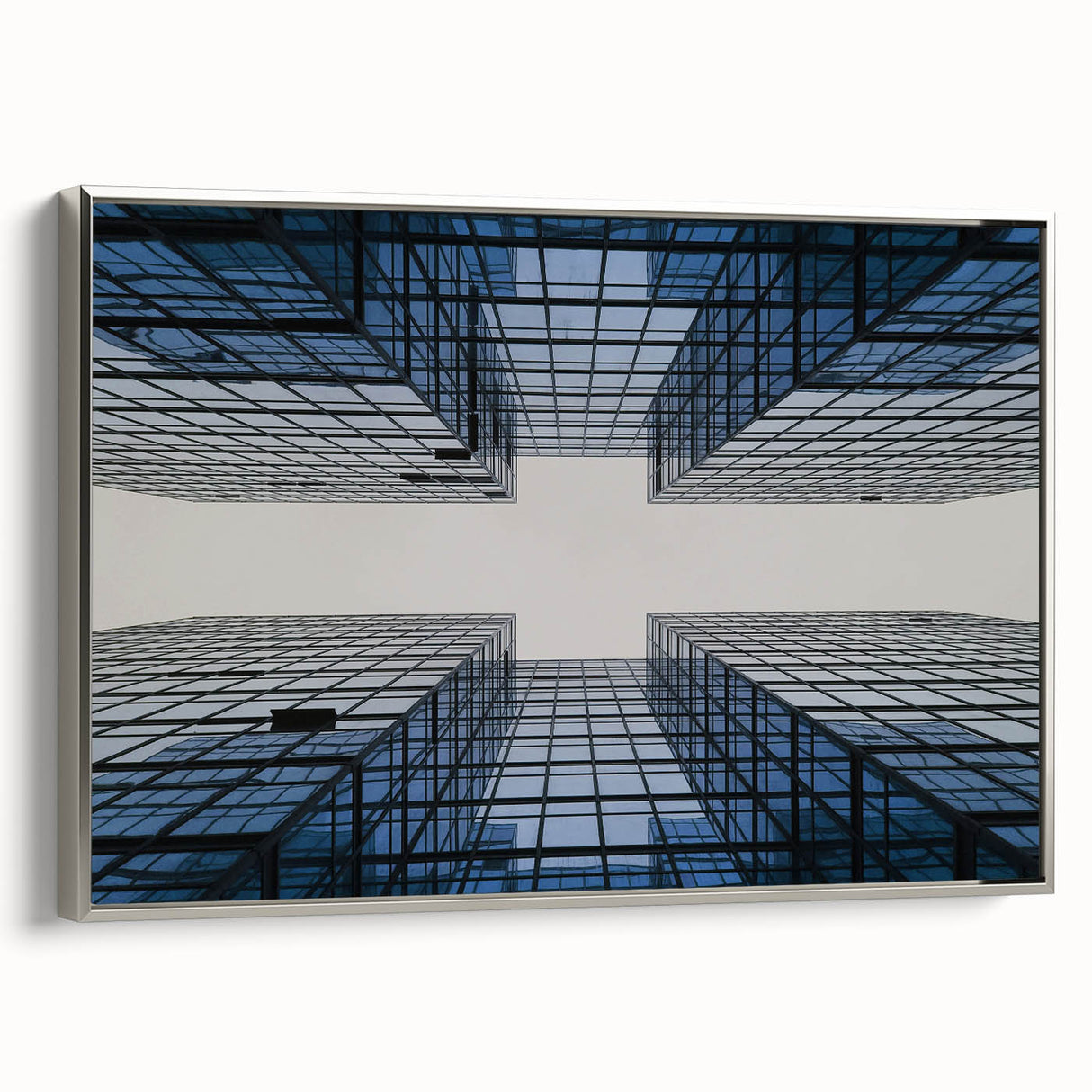 Vintage poster art of a skyscraper, rendered in black with colorful accents on a silver-framed canvas.