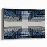 Vintage poster art of a skyscraper, rendered in black with colorful accents on a silver-framed canvas.