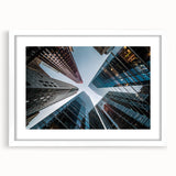 Extra large abstract art print of skyscrapers in muted gray tones, framed with a white mat, ideal for living room decor.