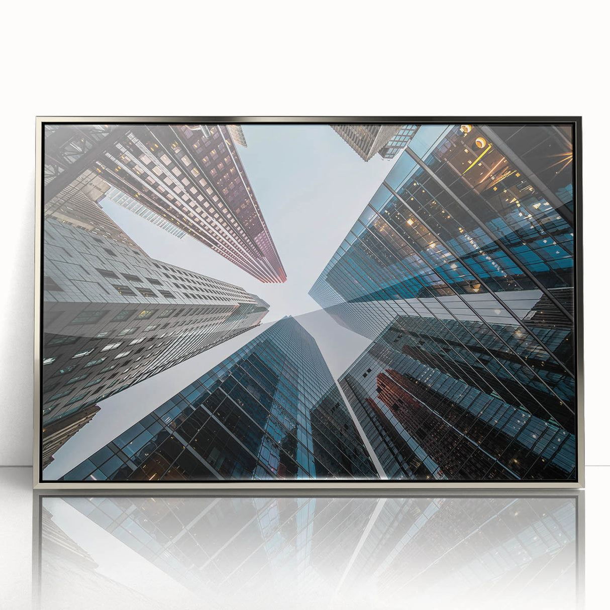Art deco poster of skyscrapers in silver acrylic frame, suitable for modern art wall decor in a nursery.