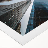 Art deco poster featuring a geometric skyscraper design in black and white on rolled canvas, suitable for dining room decor.
