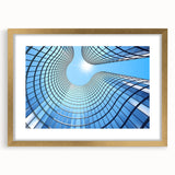 Textured abstract art print of skyscrapers in gold frame, ideal for bedroom art, featuring muted metallic tones.