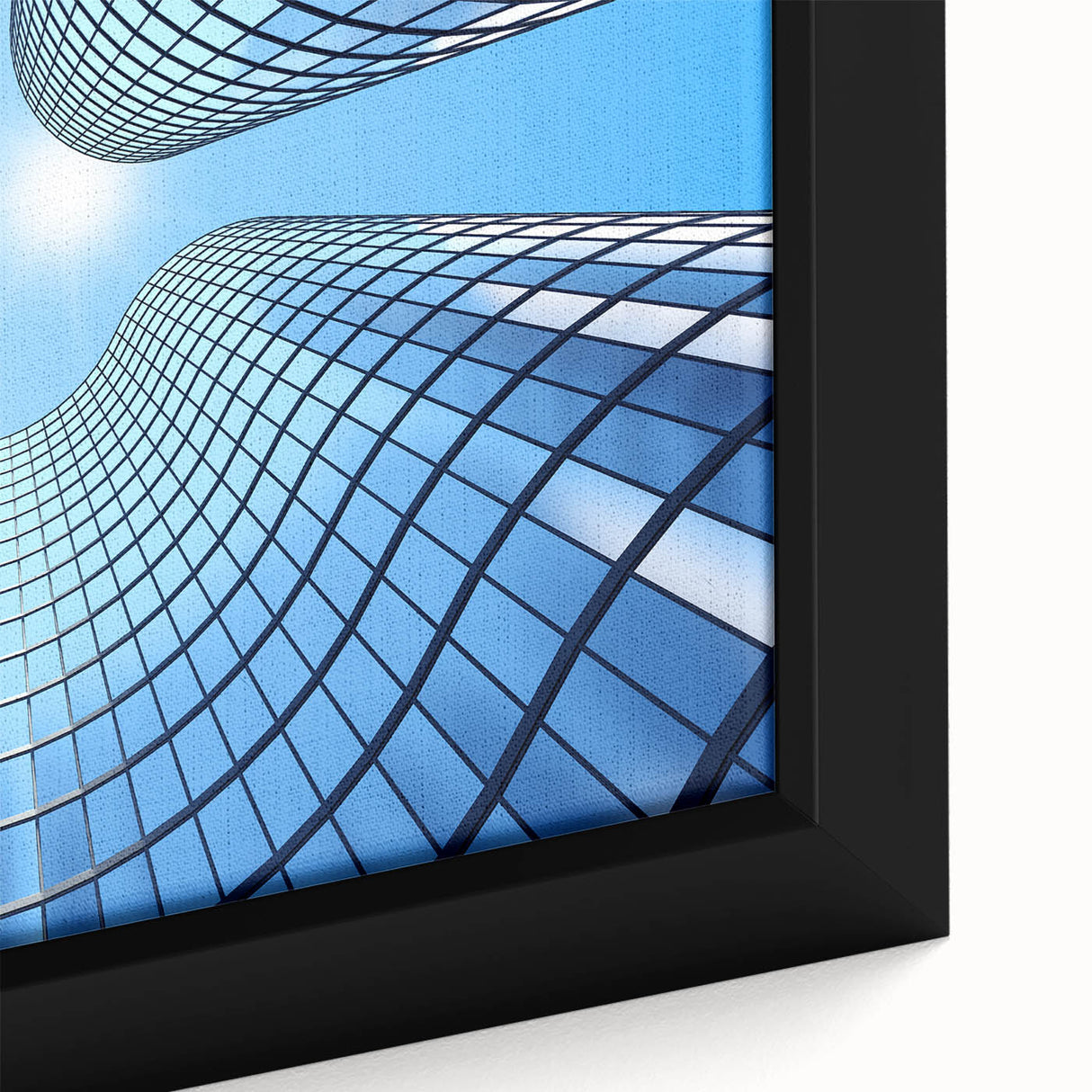 Close-up of a black wall art on framed canvas featuring a textured skyscraper design with colorful accents.