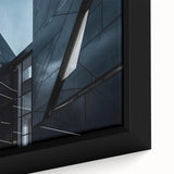 Close-up of black wall art featuring a textured skyscraper design on a framed canvas, ideal for living room decor.