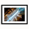 Abstract art print featuring textured, colorful skyscraper design on a large black-framed canvas.