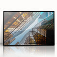 Large abstract wall art featuring a mid-century modernist skyscraper design in black and gray tones on a framed acrylic…