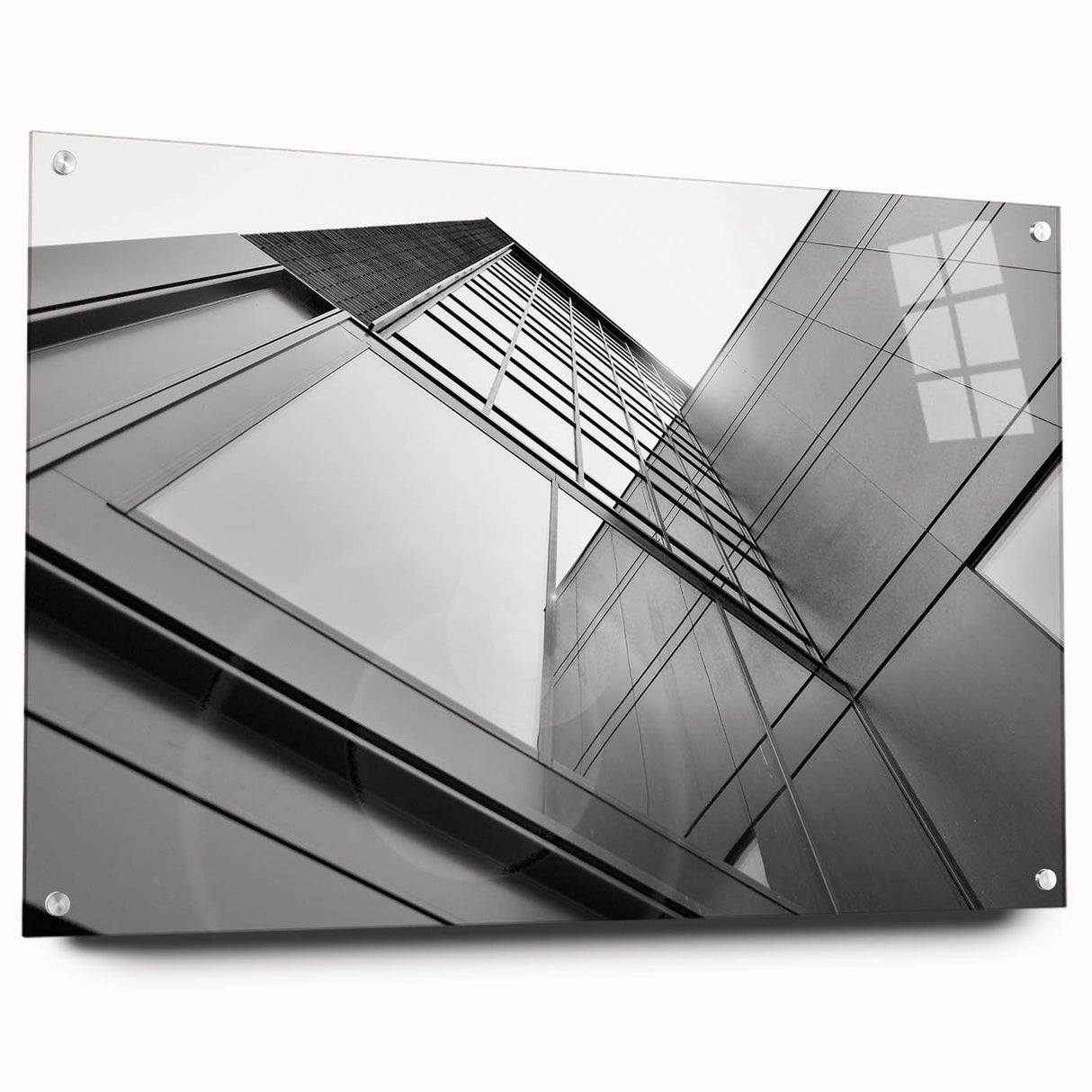 Large abstract wall art featuring geometric skyscraper designs on acrylic glass.
