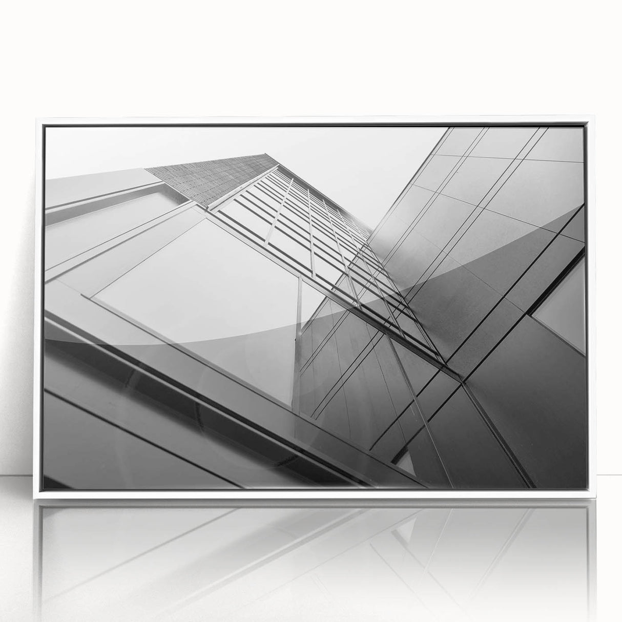 Mid-century modernist skyscraper design on a large framed acrylic print, in monochrome shades.