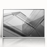 Mid-century modernist skyscraper design on a large framed acrylic print, in monochrome shades.