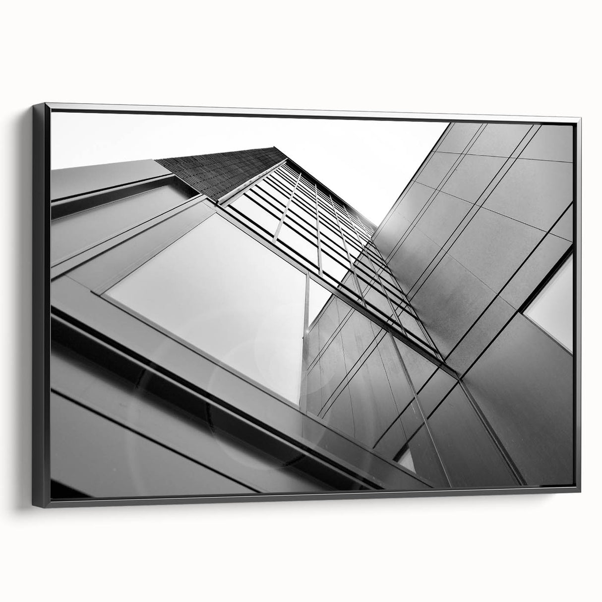 Black and white wall art featuring a vintage poster art style skyscraper landscape on framed canvas, ideal for bedroom decor.